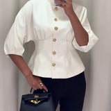 Manteau élégant à simple boutonnage de couleur unie