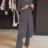 Costume élégant fendu à pois