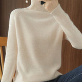 Pull simple à manches longues et col haut de couleur unie