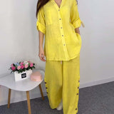 Ensemble chemisier et pantalon large en dentelle avec poche boutonnée et couleur unie