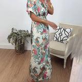 Robe élégante torsadée à col en V et imprimé botanique