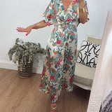 Robe élégante torsadée à col en V et imprimé botanique