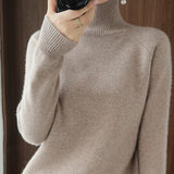 Pull simple à manches longues et col haut de couleur unie