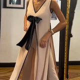 Costume élégant avec nœud sans manches