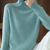 Pull simple à manches longues et col haut de couleur unie