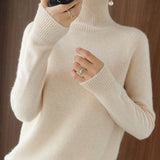 Pull simple à manches longues et col haut de couleur unie