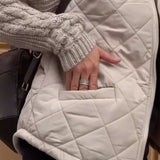 Manteau zippé à col haut de couleur unie
