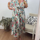 Robe élégante torsadée à col en V et imprimé botanique