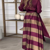 Robe élégante à rayures et à bretelles
