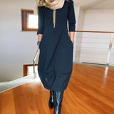 Robe élégante de couleur unie avec poche et col rond