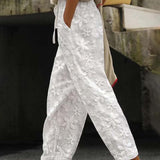 Pantalon décontracté de couleur unie à lacets brodés de fleurs