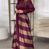 Robe élégante à rayures et à bretelles